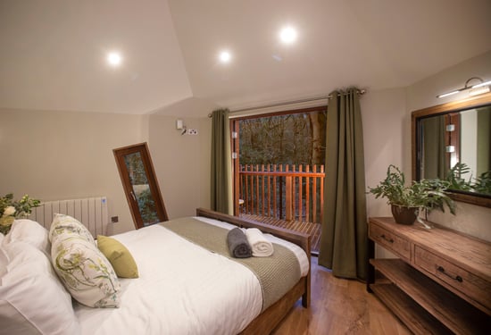 Golden Oak Treehouse bedroom at Glentress Forest