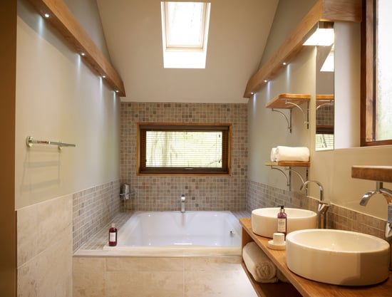 Sunken bath for two in the Golden Oak Hideaway at Forest Holidays