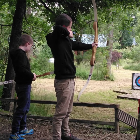 Kids taking part in archery at Forest Holidays