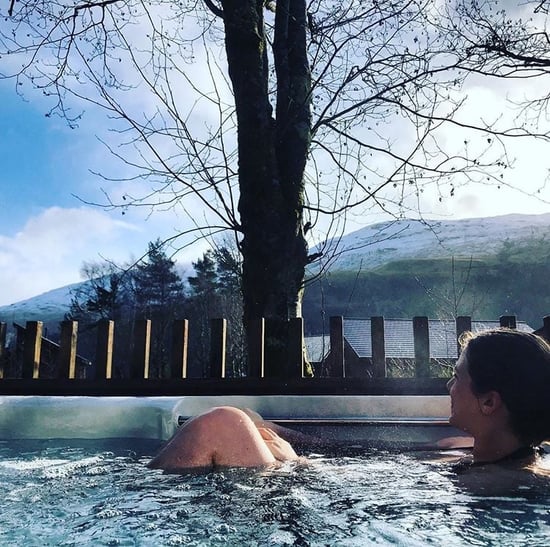 Woman relaxing in the hot tub at Ardgartan Argyll, Forest Holidays by @norty_nix