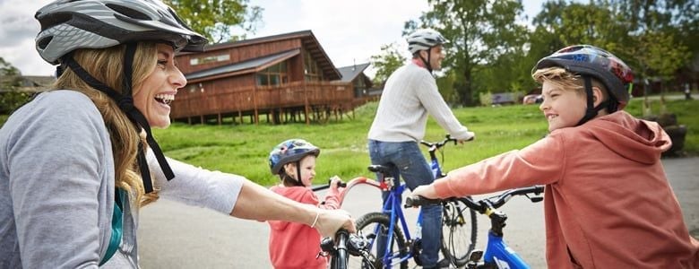 Family enjoying a cycling holiday at Forest Holidays 