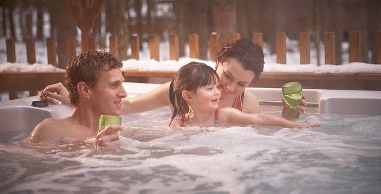 Family in the hot tub at Forest Holidays