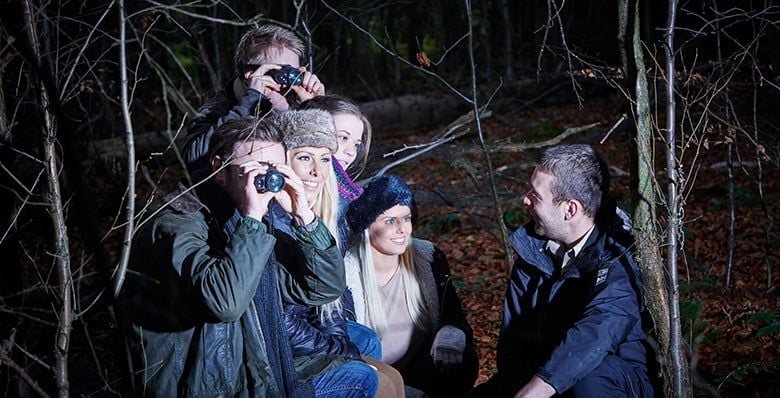 Guests at Forest Holidays taking part in Nocturnal Adventure