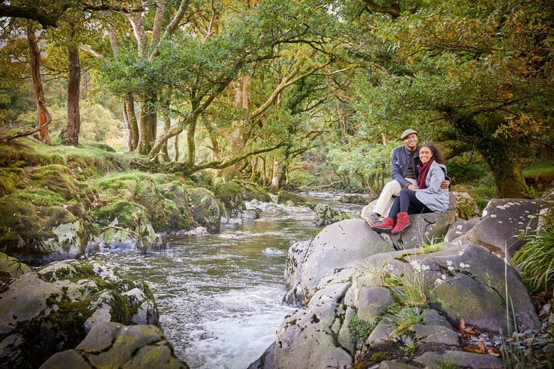 Couple exploring the forest at Beddgelert, Snowdonia