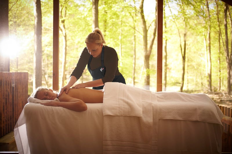 A woman having an In-cabin spa treatment at Forest Holidays