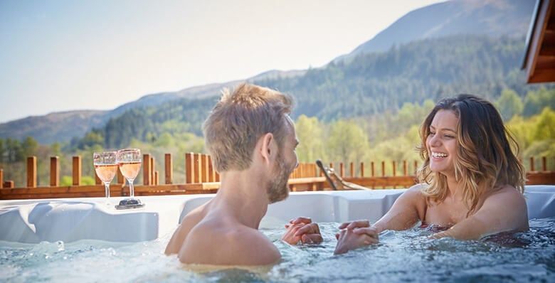 Couple enjoy time in hot tub in Strathyre