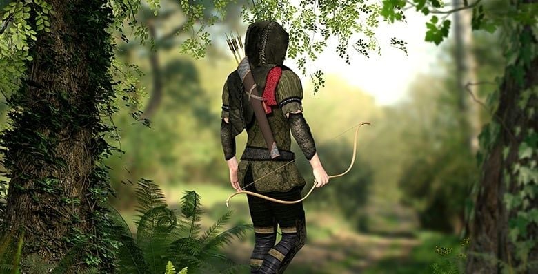 Hooded hunter in the forest