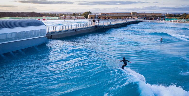 People surfing in a wave pool 