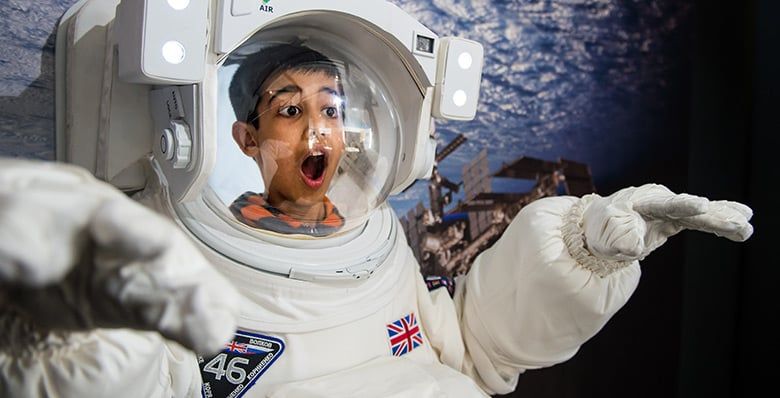 Boy inside a space suit at Winchester Science Centre Planetarium