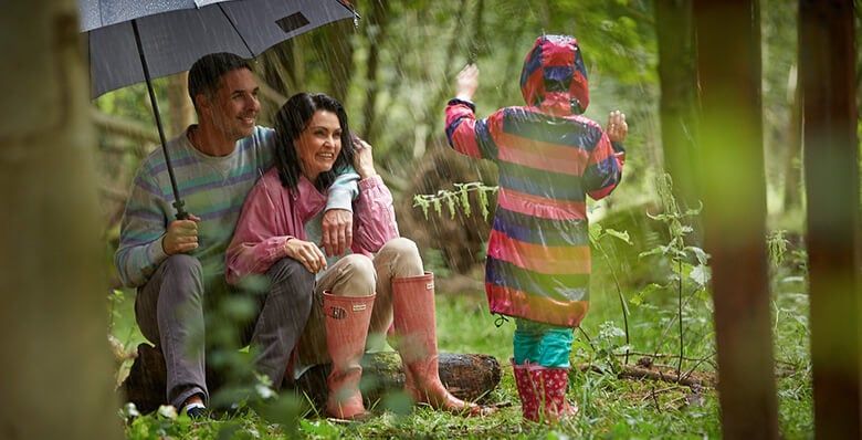 Family in a rainy forest